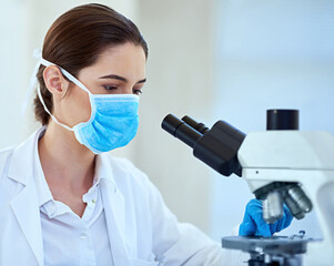 Science, laboratory and woman with microscope for medical discovery, research and lab study....