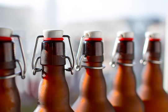 Row of bottles with bugel plug on a light background.