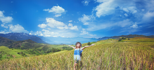 Asian women travel relax in the holiday. Stand natural touch mountain field summer. In Thailand