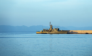 Modern patrol navy vessel in port.