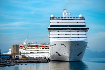 White cruise ship awaits passengers in the port of Rhodes.