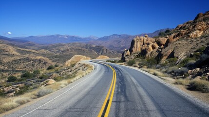 Fototapeta premium Asphalt highway that smoothly turns into a picturesque mountain landscape, flooded with the warm light of a bright day