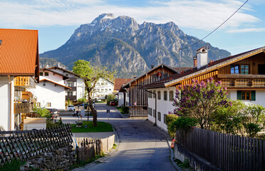 a picturesque alpine countryside in Schwangau in the Bavarian Alps on a sunny spring day (Bavaria,...