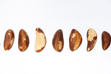 Close-up of Brazil nuts on white background top view.
