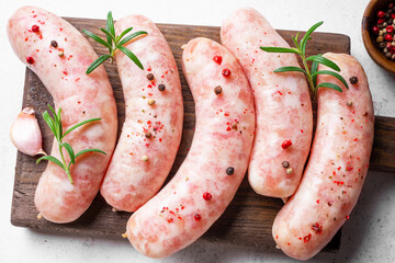 Raw sausages with spices and rosemary