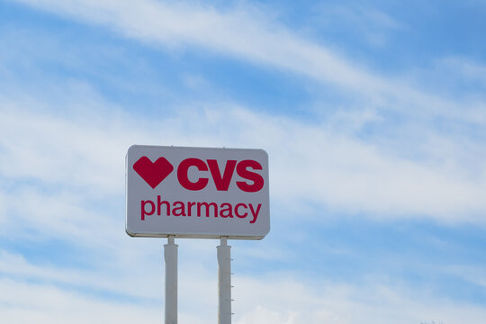 Massachusetts, USA - 19 April 2024. General view of the CVS pharmacy signboard against sky. 