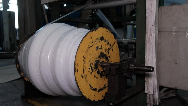 Polyethylene production process. Modern factory for the production of Bags. Production of white polypropylene flat yarn for the production of industrial bags.