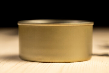 an open round can for canning on a wooden table