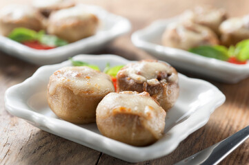 three mushrooms stuffed gratin with salad