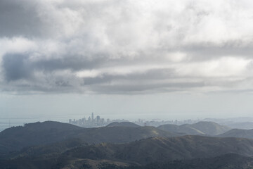 Distant view of the skyline of San Francisco as seen from atop a mountain in the Marin Headlands,...
