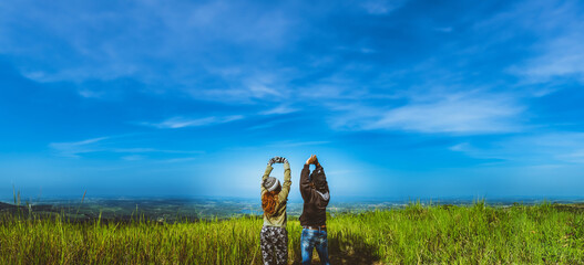 Lover women and men asians travel relax in the holiday. Stand up look landscape on the mountain in the morning. Thailand