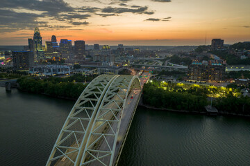 Cincinnati, Ohio with driving cars on Daniel Carter Beard Bridge highway near illuminated high...