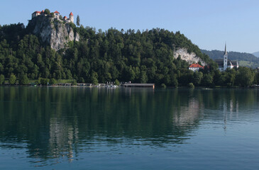 Photo of a view of Lake Bled, Bled Castle on the rock and St. Martin's Church in the town of Bled,...
