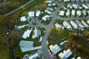 Destroyed by hurricane Ian suburban houses in Florida mobile home residential area. Consequences of...