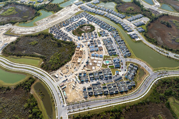 Development of residential housing in the USA. Wooden frames of new cheap American homes under construction