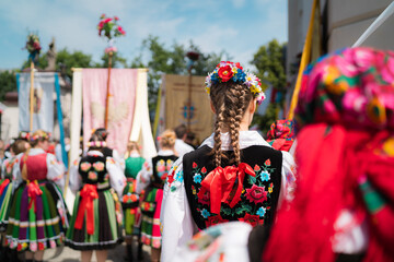 People in traditional Polish folk costumes at Łowicz Corpus Christi procession