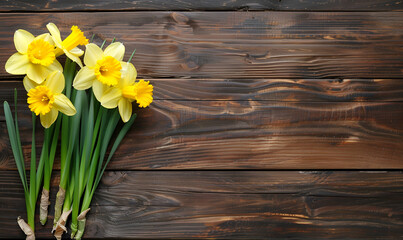 bouquet of fresh spring flowers daffodils on a wooden background.
