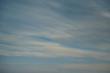 Fototapeta premium Blue evening sky in a heavenly gentle haze, pastel tones in the evening sky