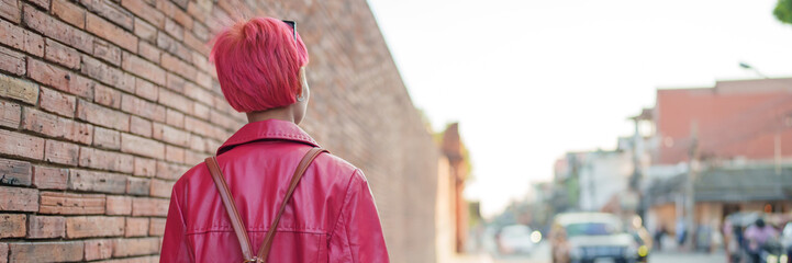 Gen z girl leather fashion with punk Asian woman tourist of local city Southeast Asia travel trendy...