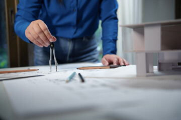 Fototapeta premium Architecture drawing on architectural project business architecture building construction Colleagues designer Planning Design on blueprint with compasses