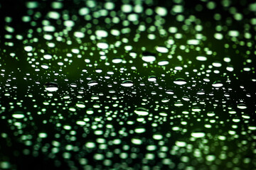 Sparkling Green Bokeh Pattern with Glowing Lights and Water Drops, Beautiful nature abstract...