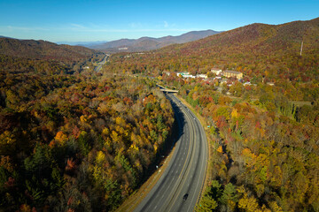 I-40 freeway road leading to Asheville in North Carolina thru Appalachian mountains with yellow...