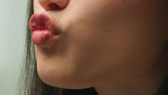 Close up mouth female lips kissing sexy seductive Asian chinese woman korean girl girlfriend air kiss love affection flirt lipstick makeup cosmetology healthy beauty injection smile face in details