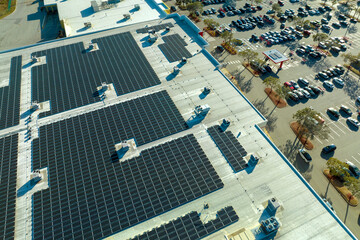 Production of sustainable energy. Solar power plant with blue photovoltaic panels mounted on...