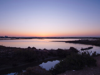 Panoramic aerial view of the salt flats of the Ebro Delta (Tarragona - Catalonia) at dawn. Sunset in the salt flats of the Ebro Delta, Spain