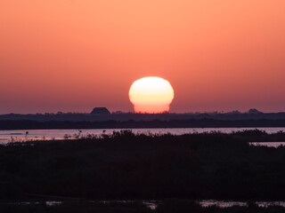 Panoramic aerial view of the salt flats of the Ebro Delta (Tarragona - Catalonia) at dawn. Sunset in the salt flats of the Ebro Delta, Spain