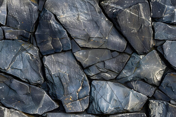seamless Background texture of black stone wall. Close-up photo of stone wall.