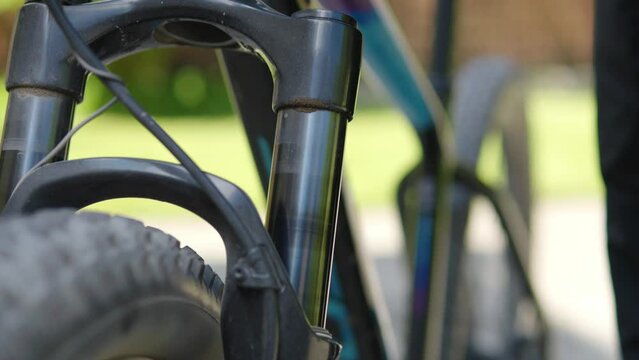 Bicycle shock absorber moving up and down. Shock absorber deflection in a mountain bike