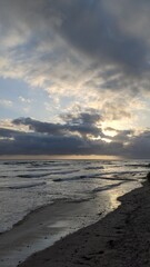 Southern California beach scenics with sunsets, surfers, tide pools and palms trees at Swamis Reef Surf Park Encinitas California.