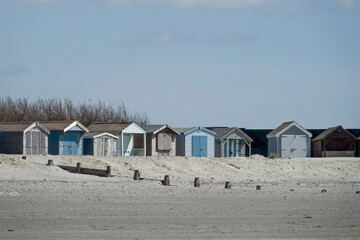 West Wittering England: April 18 2024: colourful beach huts on the sand at West Wittering West...