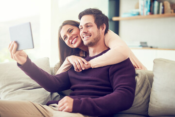 Couple, selfie and hug on sofa in home living room with memory, profile picture or vlog on web....