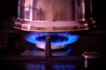 gas stove fire burns in the kitchen