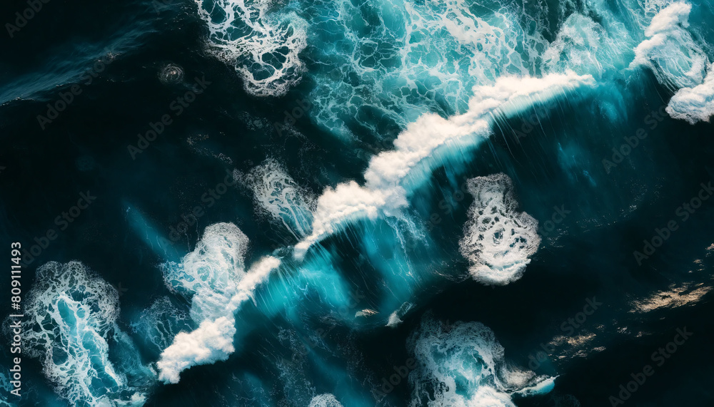 Poster the ocean with a focus on the dynamic interaction between the water's deep blue and the frothy white
