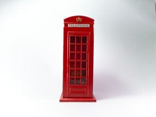 The red telephone box in white background