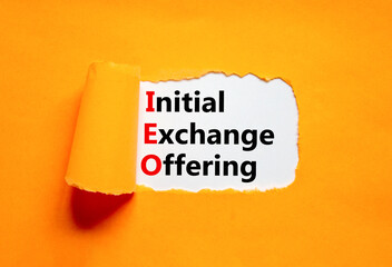 Naklejka premium IEO initial exchange offering symbol. Concept words IEO initial exchange offering on beautiful paper. Beautiful orange paper background. Business IEO initial exchange offering concept. Copy space.