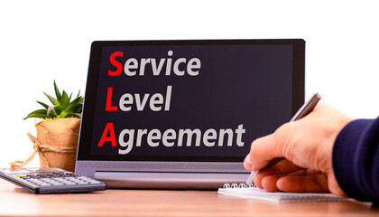 SLA service level agreement symbol. Concept words SLA service level agreement on beautiful black tablet. Beautiful white background. Business SLA service level agreement concept. Copy space.