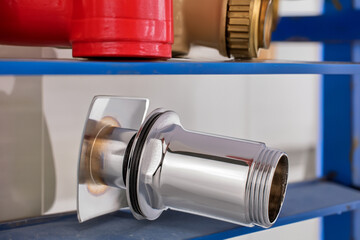 Bottom metal shower valve in plumbing shop, macro, isolated on white background.