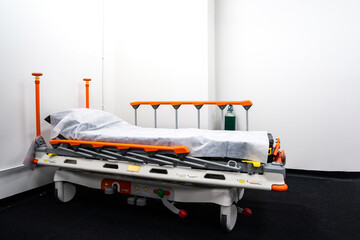 Camp bed with orange bed rails for side effect of Covid-19 vaccinated patient, it is able to be...