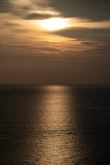Fototapeta premium Twilight Golden time in the sea view of Phrom Thep Cape, the tropical sea sunset period, scenic point of Phuket Island, The Pearl of the Andaman Sea,Thailand popular for tourist in the world.