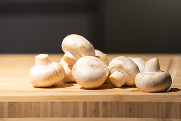 Straw mushroom is prepared on the wood board for ingredient of cooking.
