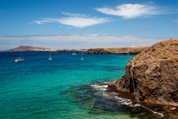 Obraz premium Playa de Papagayo beach is an idyllic turquoise waters paradise at Los Ajaches Natural Park, near Playa Blanca, Lanzarote, Canary Islands, Spain