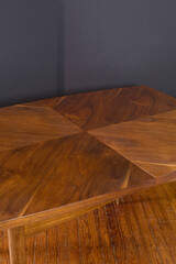Vintage dining table with extraordinary grain pattern. 1950s Midcentury Modern walnut furniture. Close-up detail photograph.