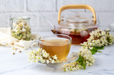 Glass cup of herbal acacia tea