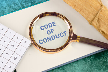 Business and code of conduct concept. Copy space. Code of conduct symbol written through a...