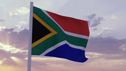 Flag of South Africa in the wind on a sunset sky
