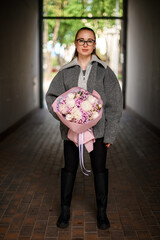 girl in gray jacket amid city bustle.
